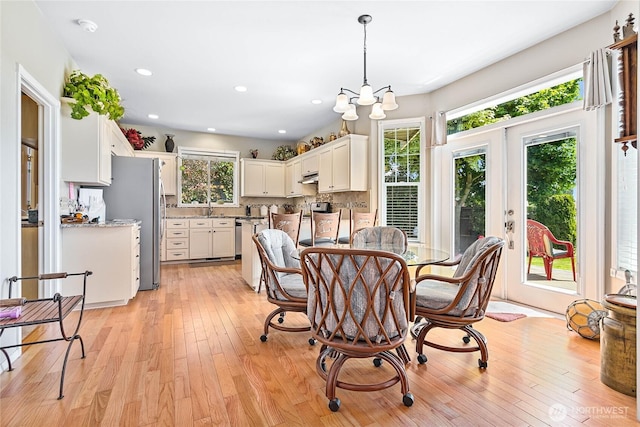 1521 Westview Pl, Lynden, WA 98264 - dining room featuring light wood-style floors, french doors, a chandelier, and recessed lighting