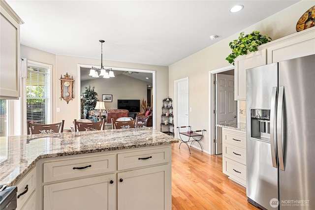 1521 Westview Pl, Lynden, WA 98264 - kitchen featuring stainless steel refrigerator with ice dispenser, a chandelier, light wood-style flooring, decorative light fixtures, and white cabinetry