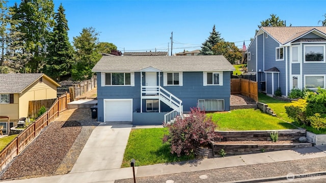 907 S Balsam St, Moses Lake, WA 98837 - view of front of home featuring stairs, concrete driveway, an attached garage, and a shingled roof