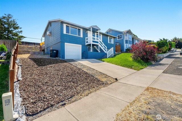 907 S Balsam St, Moses Lake, WA 98837 - view of front of house featuring stairs, driveway, and a garage
