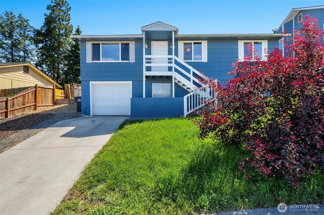 907 S Balsam St, Moses Lake, WA 98837 - view of front of property with an attached garage, driveway, and stairway
