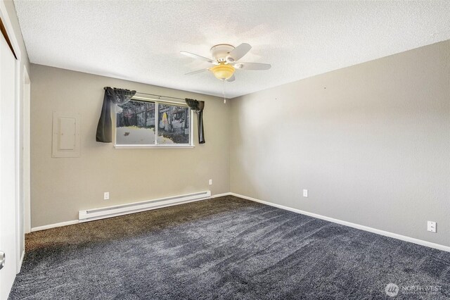 907 S Balsam St, Moses Lake, WA 98837 - carpeted spare room with a baseboard radiator, ceiling fan, a textured ceiling, and baseboards