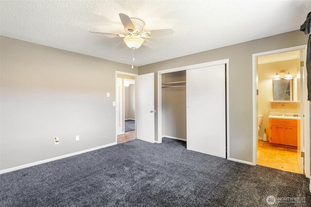 907 S Balsam St, Moses Lake, WA 98837 - unfurnished bedroom featuring carpet floors, a closet, ceiling fan, a textured ceiling, and baseboards