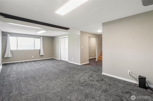 907 S Balsam St, Moses Lake, WA 98837 - unfurnished room featuring stairs, dark colored carpet, and baseboards