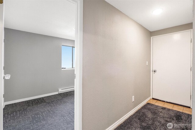 907 S Balsam St, Moses Lake, WA 98837 - corridor featuring baseboard heating, carpet flooring, and baseboards