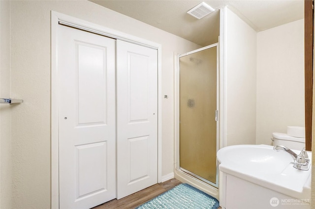 907 S Balsam St, Moses Lake, WA 98837 - full bath with a shower stall, wood finished floors, and baseboards