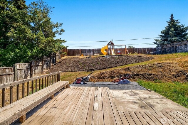 907 S Balsam St, Moses Lake, WA 98837 - wooden terrace with a playground and a fenced backyard