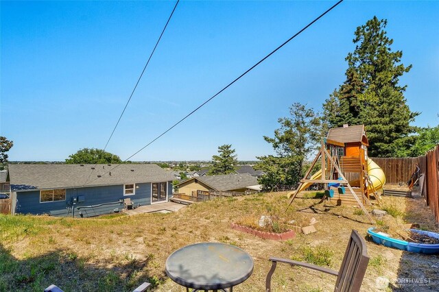 907 S Balsam St, Moses Lake, WA 98837 - fenced yard featuring a playground