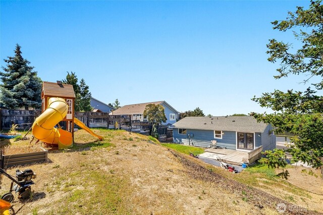907 S Balsam St, Moses Lake, WA 98837 - view of yard with a playground and a wooden deck