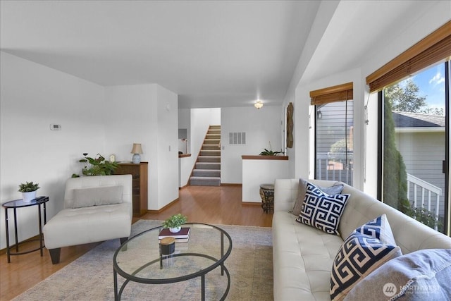 8929 48th Pl W, Mukilteo, WA 98275 - living room featuring wood finished floors, stairs, and lofted ceiling