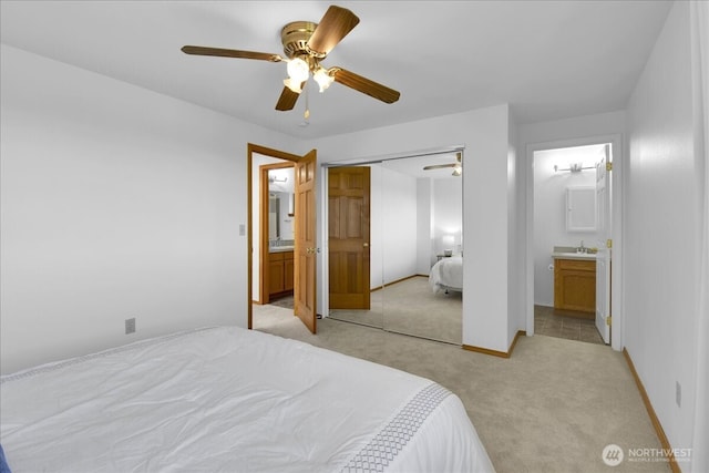 8929 48th Pl W, Mukilteo, WA 98275 - bedroom with light colored carpet, a closet, ceiling fan, ensuite bathroom, and baseboards