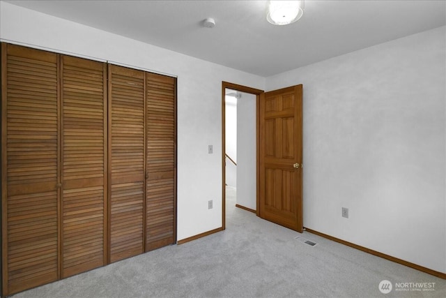 8929 48th Pl W, Mukilteo, WA 98275 - unfurnished bedroom featuring a closet, carpet, and baseboards