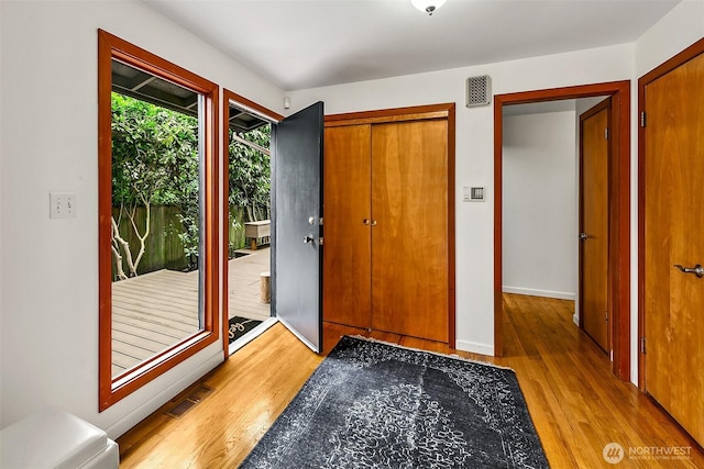 718 N 59th St, Seattle, WA 98103 - foyer featuring light wood-type flooring and baseboards