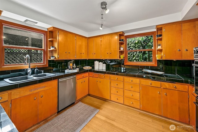 718 N 59th St, Seattle, WA 98103 - kitchen featuring open shelves, dishwasher, a sink, and light wood-style floors