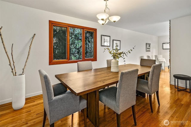 718 N 59th St, Seattle, WA 98103 - dining area featuring wood finished floors and baseboards