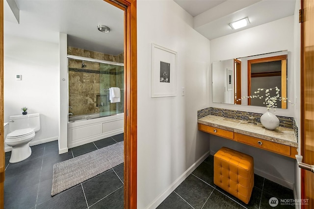 718 N 59th St, Seattle, WA 98103 - full bath with toilet, tile patterned flooring, enclosed tub / shower combo, and baseboards
