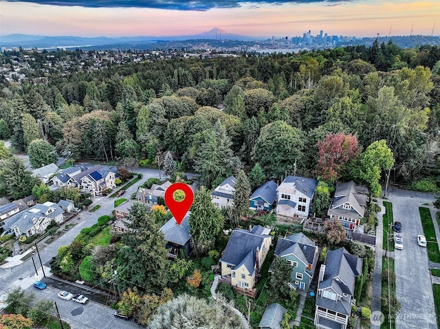 718 N 59th St, Seattle, WA 98103 - aerial view at dusk of a residential view and a forest view