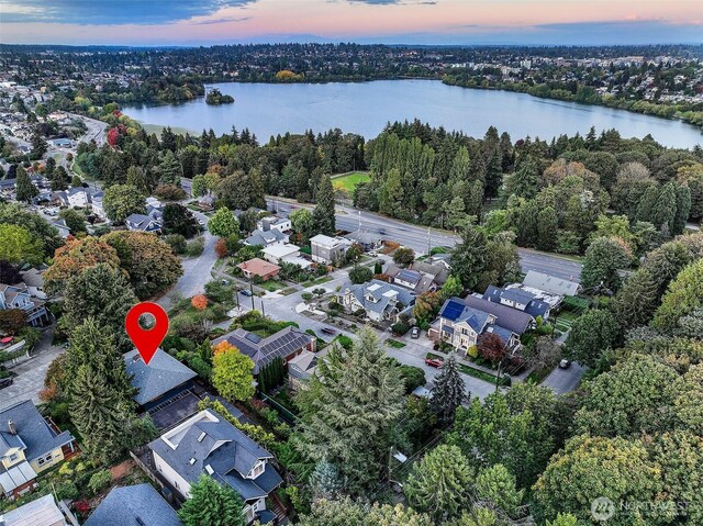 718 N 59th St, Seattle, WA 98103 - aerial view of property and surrounding area with a large body of water and nearby suburban area