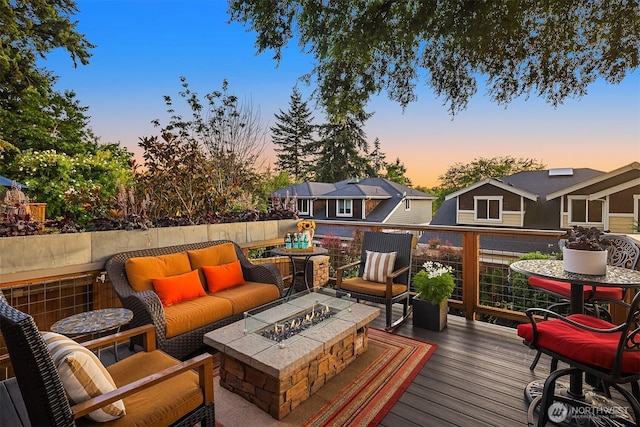 5613 21st Ave SW, Seattle, WA 98106 - deck at dusk featuring an outdoor living space with a fire pit