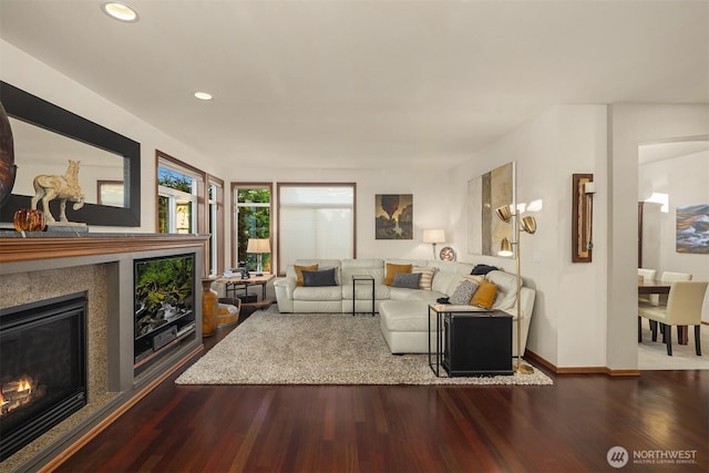 5613 21st Ave SW, Seattle, WA 98106 - living area with a glass covered fireplace, wood finished floors, and recessed lighting