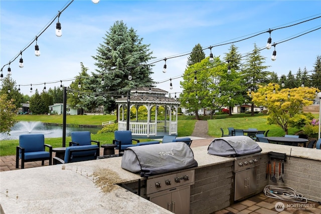 1427 100th St SW Unit 145, Everett, WA 98204 - view of patio with a gazebo and a water view