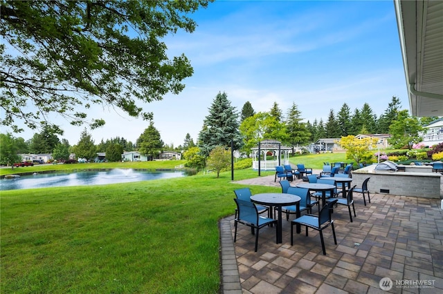1427 100th St SW Unit 145, Everett, WA 98204 - view of green lawn featuring a water view, a patio area, and outdoor dining area