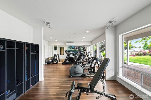1427 100th St SW Unit 145, Everett, WA 98204 - exercise room with wood finished floors, a wall unit AC, recessed lighting, and track lighting