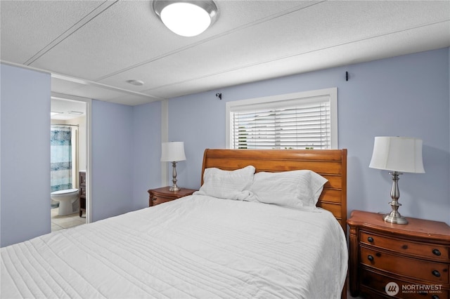 1427 100th St SW Unit 145, Everett, WA 98204 - tiled bedroom featuring ensuite bath and a textured ceiling