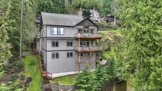 104 Grand View Ln, Bellingham, WA 98229 - rear view of property with stairway, a balcony, and a shingled roof