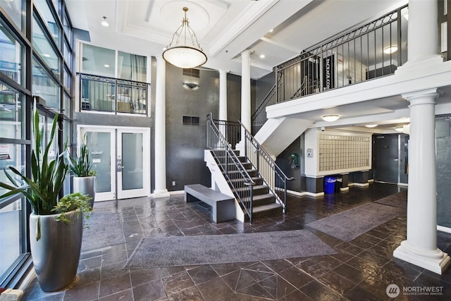 425 Vine St Unit 513, Seattle, WA 98121 - community lobby with stairway, a towering ceiling, and recessed lighting