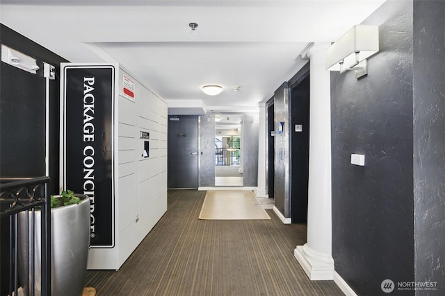 425 Vine St Unit 513, Seattle, WA 98121 - corridor featuring dark colored carpet and a textured wall