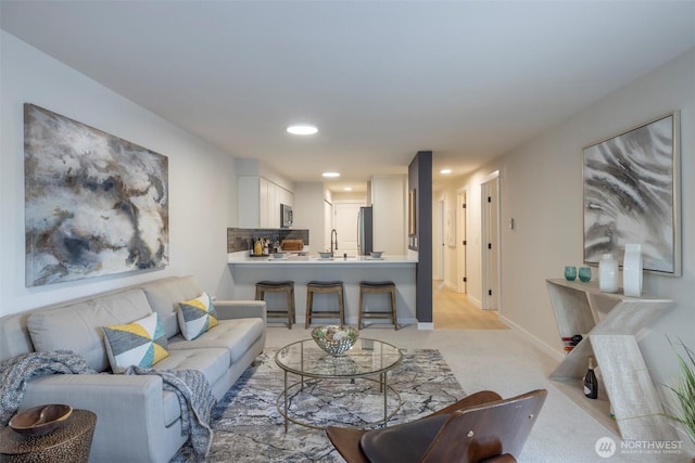11215 NE 128th St Unit L-203, Kirkland, WA 98034 - living area with light colored carpet, recessed lighting, and baseboards