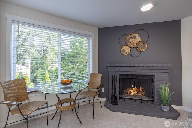 11215 NE 128th St Unit L-203, Kirkland, WA 98034 - carpeted dining area with a brick fireplace and baseboards