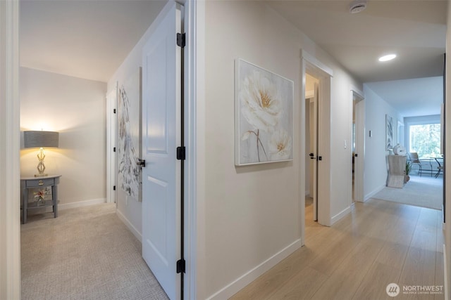 11215 NE 128th St Unit L-203, Kirkland, WA 98034 - hallway with baseboards and light wood-type flooring