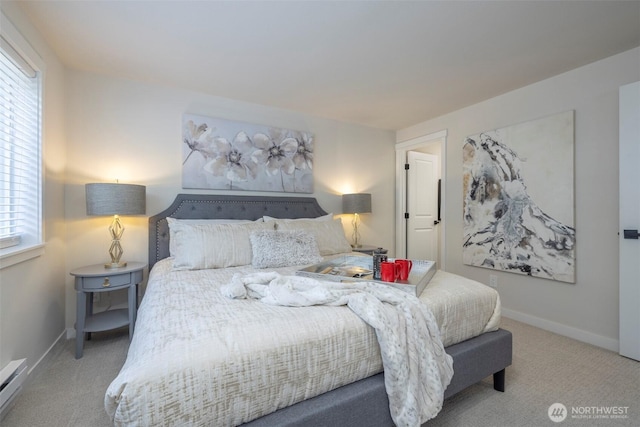 11215 NE 128th St Unit L-203, Kirkland, WA 98034 - carpeted bedroom with baseboards and a baseboard heating unit