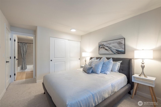 11215 NE 128th St Unit L-203, Kirkland, WA 98034 - bedroom featuring carpet, baseboards, and a closet