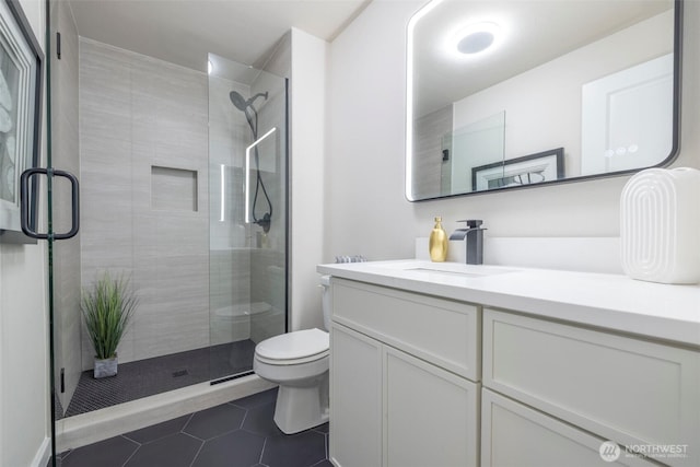 11215 NE 128th St Unit L-203, Kirkland, WA 98034 - full bathroom with toilet, vanity, tile patterned flooring, and a stall shower