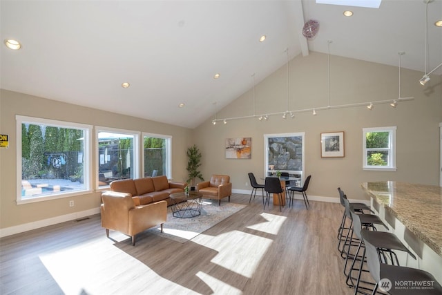 11215 NE 128th St Unit L-203, Kirkland, WA 98034 - living room with light wood-style flooring, high vaulted ceiling, beamed ceiling, baseboards, and recessed lighting