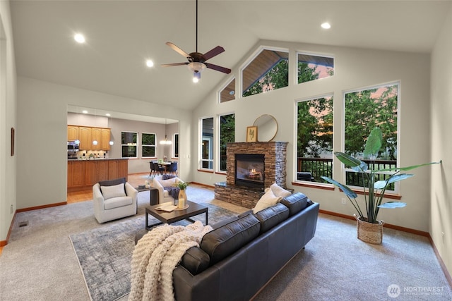8 Southern Ct, Bellingham, WA 98229 - living area with light carpet, a ceiling fan, a stone fireplace, recessed lighting, and high vaulted ceiling