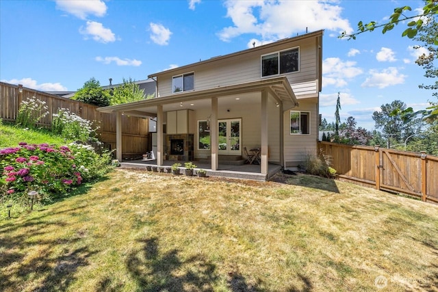 2025 NE 37th Pl, Renton, WA 98056 - back of house with a fenced backyard, a patio, and french doors