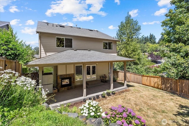 2025 NE 37th Pl, Renton, WA 98056 - rear view of property featuring a fenced backyard, french doors, a patio area, and roof with shingles