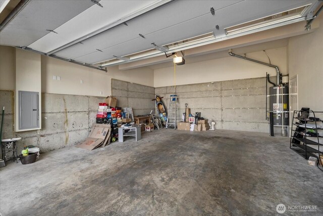 2025 NE 37th Pl, Renton, WA 98056 - garage featuring electric panel, secured water heater, and a garage door opener
