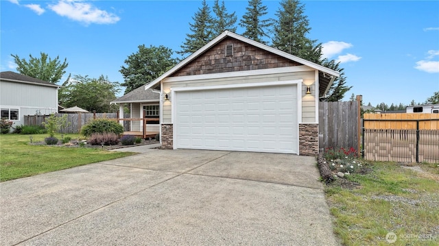 215 19th St, Gold Bar, WA 98251 - view of front of home with stone siding and a garage