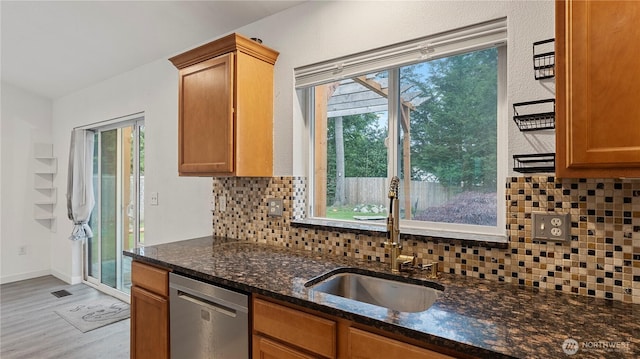 215 19th St, Gold Bar, WA 98251 - kitchen with stainless steel dishwasher, a sink, light wood-type flooring, and plenty of natural light