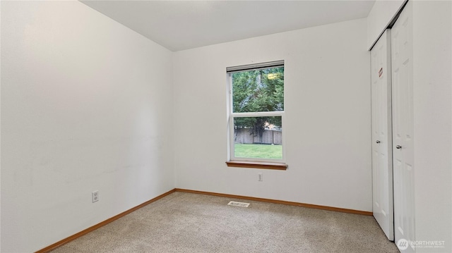 215 19th St, Gold Bar, WA 98251 - unfurnished bedroom with a closet, baseboards, and carpet