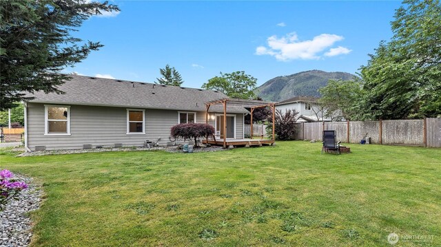 215 19th St, Gold Bar, WA 98251 - rear view of property with a pergola, a deck with mountain view, and a shingled roof