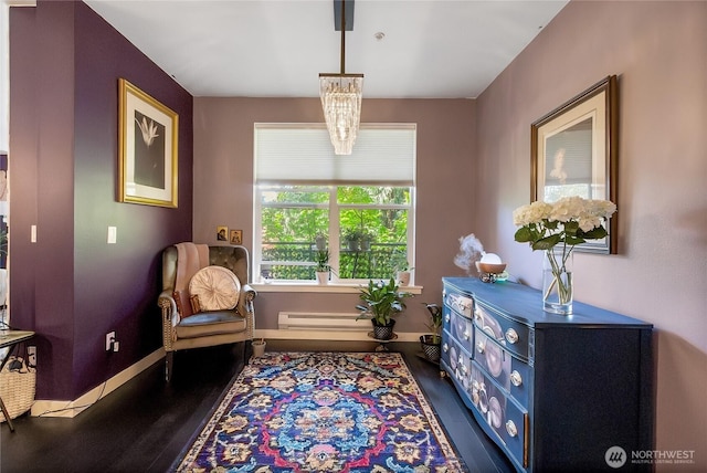 55 Williams Ave S Unit 209, Renton, WA 98057 - sitting room with wood finished floors, baseboards, and a baseboard heating unit