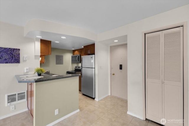 720 Lakeside Ave S Unit 406, Seattle, WA 98144 - kitchen with appliances with stainless steel finishes, a peninsula, recessed lighting, baseboards, and light tile patterned flooring