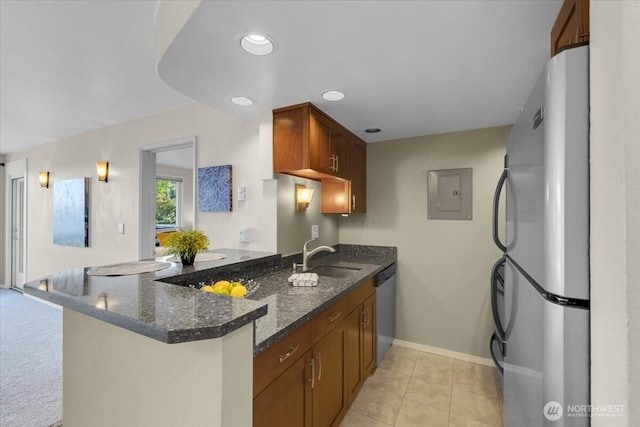 720 Lakeside Ave S Unit 406, Seattle, WA 98144 - kitchen with stainless steel appliances, a sink, electric panel, a peninsula, and dark stone countertops