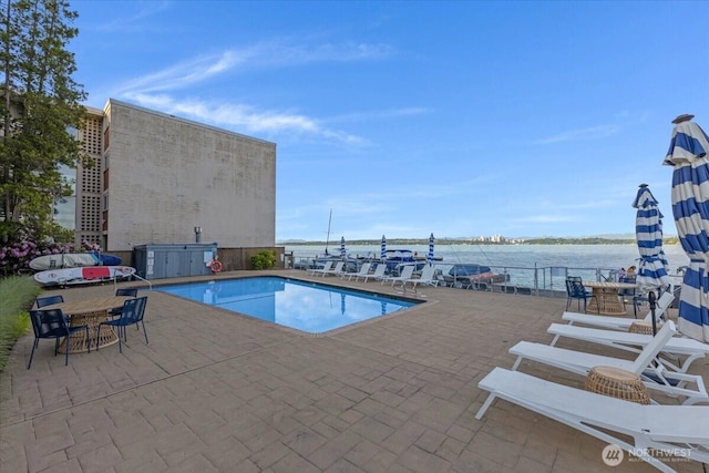 720 Lakeside Ave S Unit 406, Seattle, WA 98144 - community pool featuring a water view, a patio area, and outdoor dining space